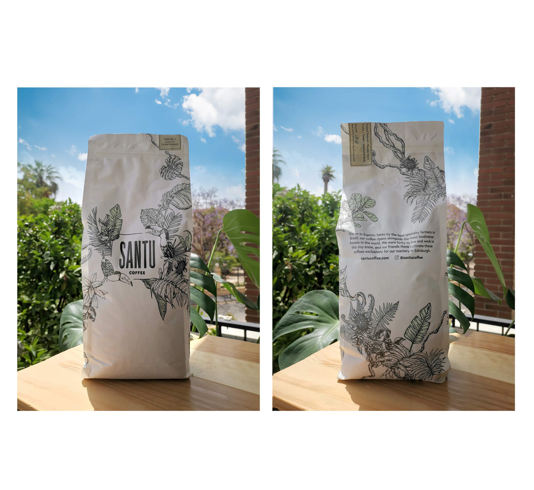 1kg white coffee packaging with design of Brazilian plants and animals, sitting on a table with plants and blue sky
